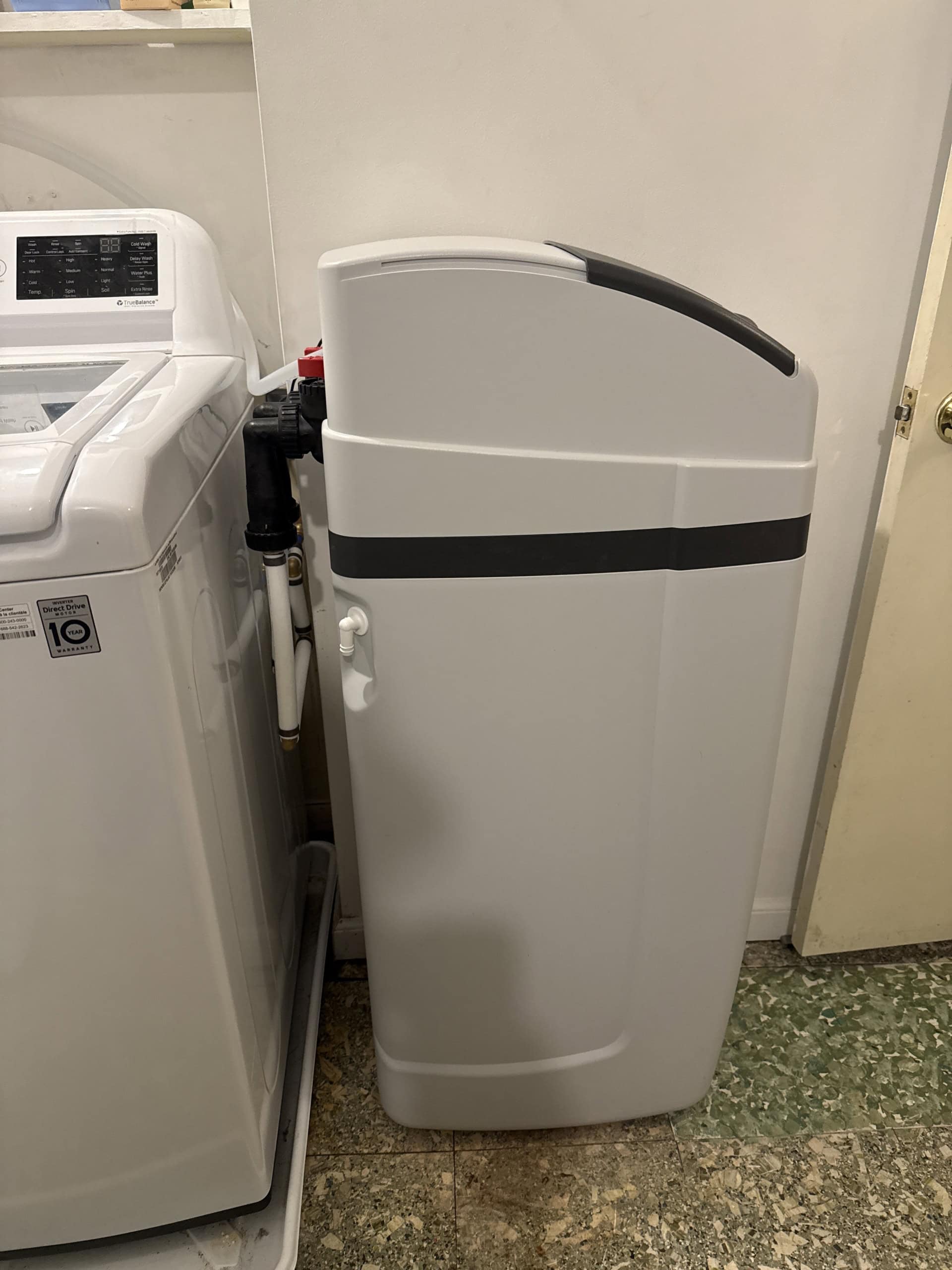 Cabinet Water Softener for Home next to Washing Machine