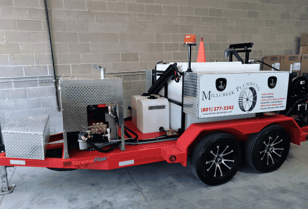 Millcreek Plumbing Xtremeflow Trailer Hydro Jetter Millcreek Plumbing's red XtremeFlow trailer mounted hydro jetter with hose reels and water tank